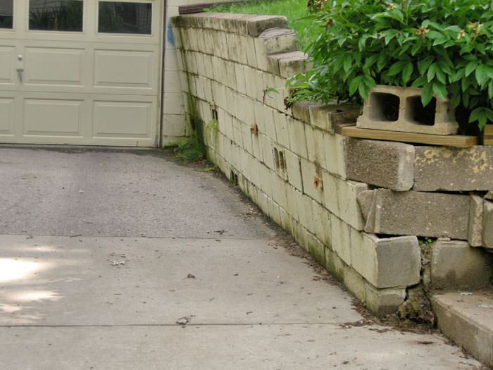 Failing Retaining Wall Repair In Minnesota And Wisconsin Concrete A Failing Retaining Wall Around Driveway In Duluth